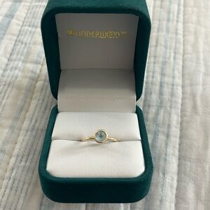 This is a 14K solid gold Blue Topaz stone ring from Underwood’s Jewelers!
